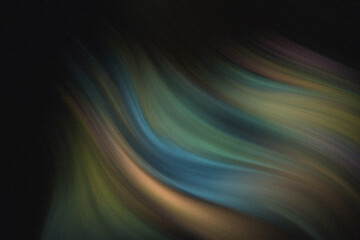 Hands holding heart shaped earth surrounded by colorful foliage against a dark background image capture