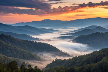 Obraz premium Misty Mountain Sunrise: A Breathtaking View of Fog-Shrouded Peaks
