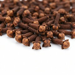 Close-up of aromatic dried cloves on white background.
