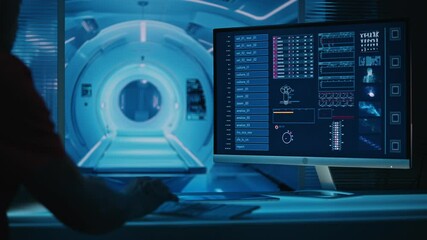 Male scientist working in a futuristic laboratory with a MRI machine. Computer screen displaying a futuristic medical application scanning the patient's results - Powered by Adobe