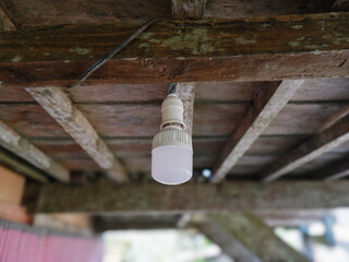 Obraz premium selective focus on the white led lights hanging from the ceiling. village house