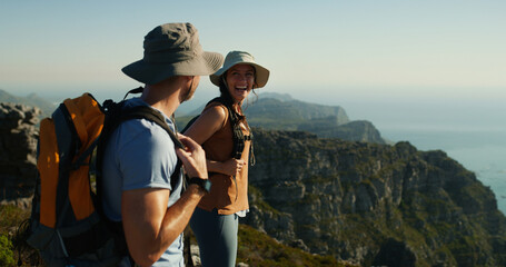 Happy couple, hiking or mountain view with blue sky for adventure, travel or sightseeing vacation. Man, woman or hikers with smile, hat or backpack for trekking challenge, journey or outdoor exercise