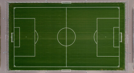 Aerial view of a well-maintained football field with white markings
