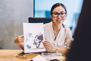 Cheerful Caucasian woman in glasses for provide eyes correction discussing corporate planning...