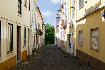 Charming cobblestone street in Caldas da Rainha Portugal lined with colorful traditional buildings