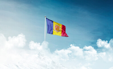 Andorra national flag with mast waving in beautiful sky. Andorra flag for Republic Day and Independence Day.
