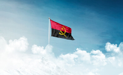 Angola national flag with mast waving in beautiful sky. Angola flag for Republic Day and Independence Day.