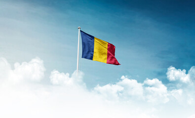 Chad national flag with mast waving in beautiful sky. Chad flag for Republic Day and Independence Day.