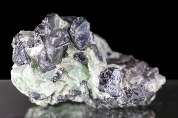 Mineral hematite - crystals in noble talc on a black background