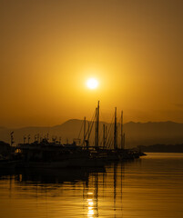 The harbour of Latchi in orange colour when the sun is rising