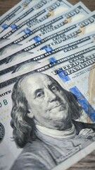 Close-Up Stack of U.S. $100 Bills | Detailed Currency Photography | Concept of Finance, Wealth Management, Economic Branding