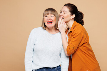 Elder parent mom 50s years old with young adult daughter two women together wears casual clothes...