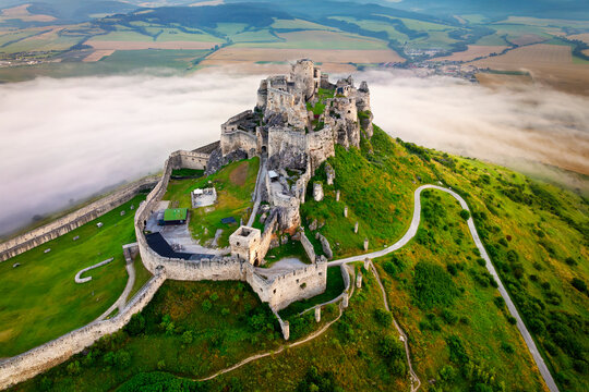 Aerial view of Spis Castle (Spissky hrad, Slovakia) on fogy summer morning