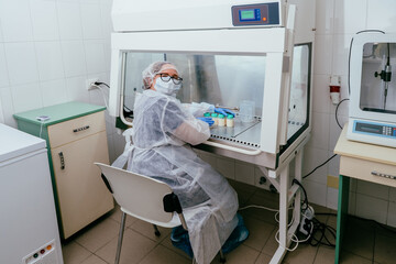 Female milk technician working in sterile lab