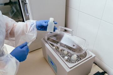 Donor milk bottle placed into warming equipment