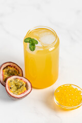 tropical Bubble Tea, Isolated on White Background. Colorful, Fresh Orange Boba Drink with Fruit Fizzy Jellies and Ice Cubes. Tapioca pearls. 