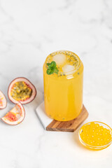 tropical Bubble Tea, Isolated on White Background. Colorful, Fresh Orange Boba Drink with Fruit Fizzy Jellies and Ice Cubes. Tapioca pearls. 