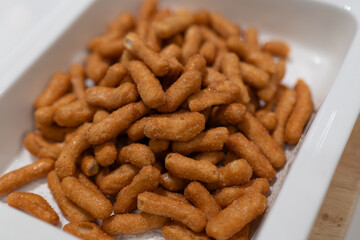 Crispy Savory Snacks in White Square Plate, Perfect for Relaxing Moments