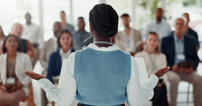 Presentation, office and back of woman with business people for conference, training or meeting. Corporate speaker, discussion and workers in workshop, convention and seminar for financial planning