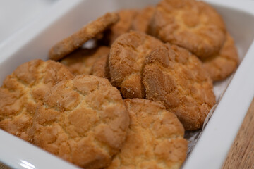 Delicious Biscuits in White Container, Crispy and Sweet Aroma