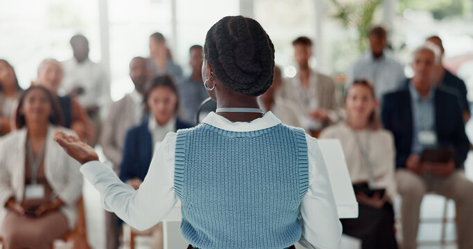 Presentation, speech and woman with business people in office for conference, training or discussion in meeting. Corporate, podium and back of speaker in workshop, convention and seminar for coaching