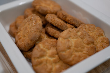 Delicious Biscuits in White Container, Crispy and Sweet Aroma