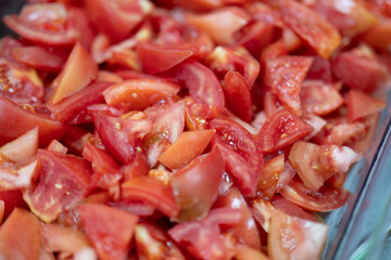 Fresh Chopped Tomato Pieces in Clear Container Ready for Cooking or Salad