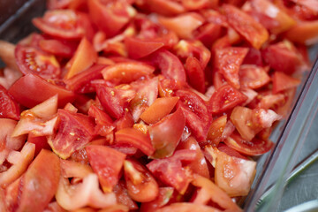 Fresh Chopped Tomato Pieces in Clear Container Ready for Cooking or Salad