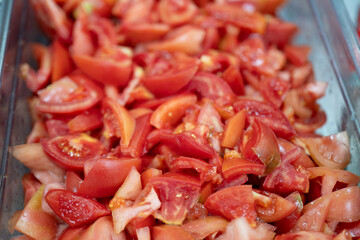 Fresh Chopped Tomato Pieces in Clear Container Ready for Cooking or Salad
