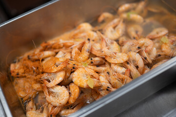 Cooked Shrimp in Hot Broth with Herbs and Steam Rising