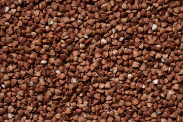 Buckwheat groats, top view. Raw large buckwheat grains. An ingredient for cooking.