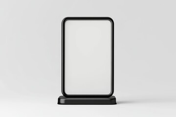 Blank black outdoor advertising display.  A modern, minimalist, vertical sign with a clean, empty white surface, perfect for advertising or promotion.  Features a sturdy black frame and base
