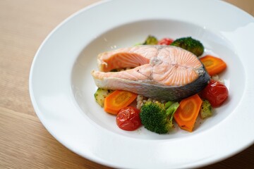 Baked salmon steak with vegetables. Diet menu. Top view