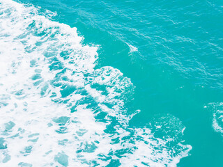 Aerial view clear blue sea background. Summer travel, at the sea in Asia, during the holiday season, giving a natural relaxing feeling. Beautiful nature environment. Travel Thailand. Ocean waves water