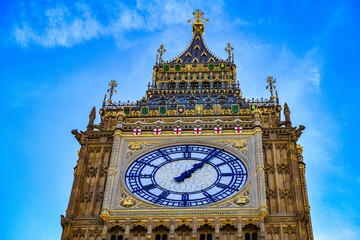 Details of the Big Ben tower and clock with golden ornaments