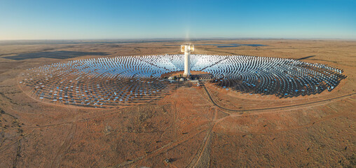 Expansive array of mirrors surround Khi Solar One concentrated solar tower in dry desert landscape of South Africa © South Africa Stock