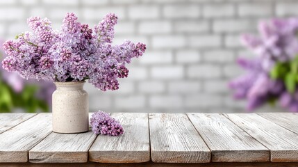 Beautiful bouquet of lilac flowers in a rustic vase placed on a weathered wooden table against a blurred background