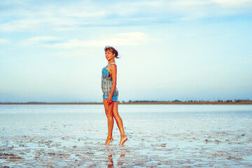 a girl in a swimsuit on a salt lake