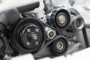Close-up View of a Car Timing Belt and Pulleys Showcasing Mechanical Components Under the Hood