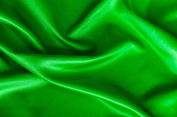 Polished dark green silk cloth with silky sheen and beautiful natural draping. Suitable for design and wallpaper background
