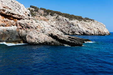 The rocky coastline of the island, in the middle of the sea in Turkey. The seascape is mesmerizing with its view and the beauty of nature.