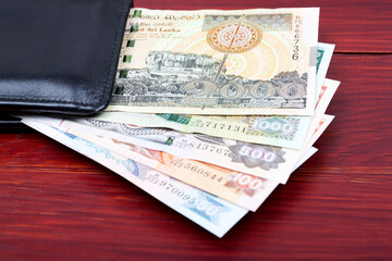 Sri Lankan rupee in the black wallet