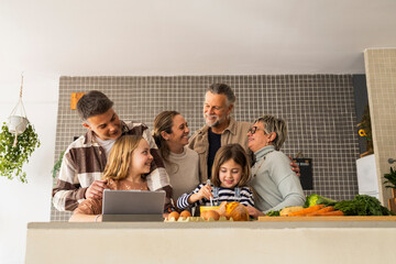 Three-generation family enjoying time together in the kitchen