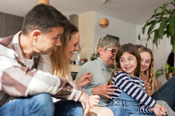 Family enjoying a joyful moment together indoors