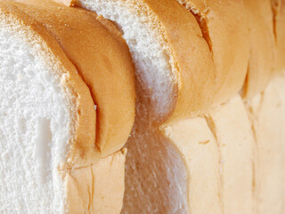 Close-up of freshly sliced ​​soft and fragrant bread with white bread,brown bread crust macro