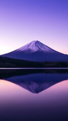 Majestic snow-capped mountain reflected in tranquil lake waters at twilight.
