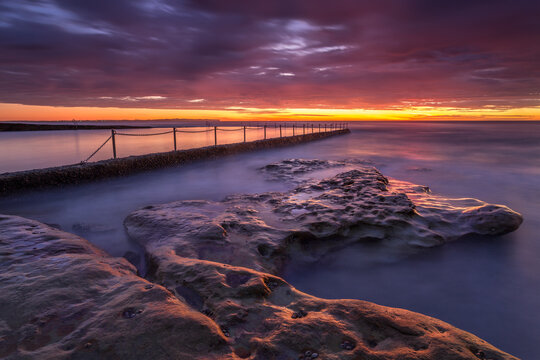Red dawn skies at Oak Park Ocean Pool Cronulla