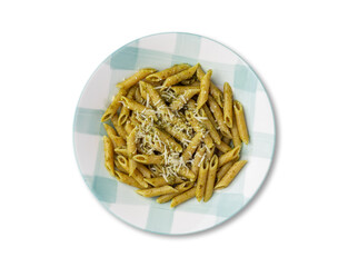 Italian pasta penne on a plate with pesto sauce and parmesan cheese isolated over white background