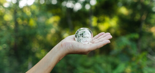 Protecting the world and the environment concept, globe in hand