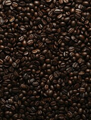 Fototapeta premium Roasted coffee beans background. Rich, dark brown coffee beans texture, perfect for cafe menus, websites, or packaging.